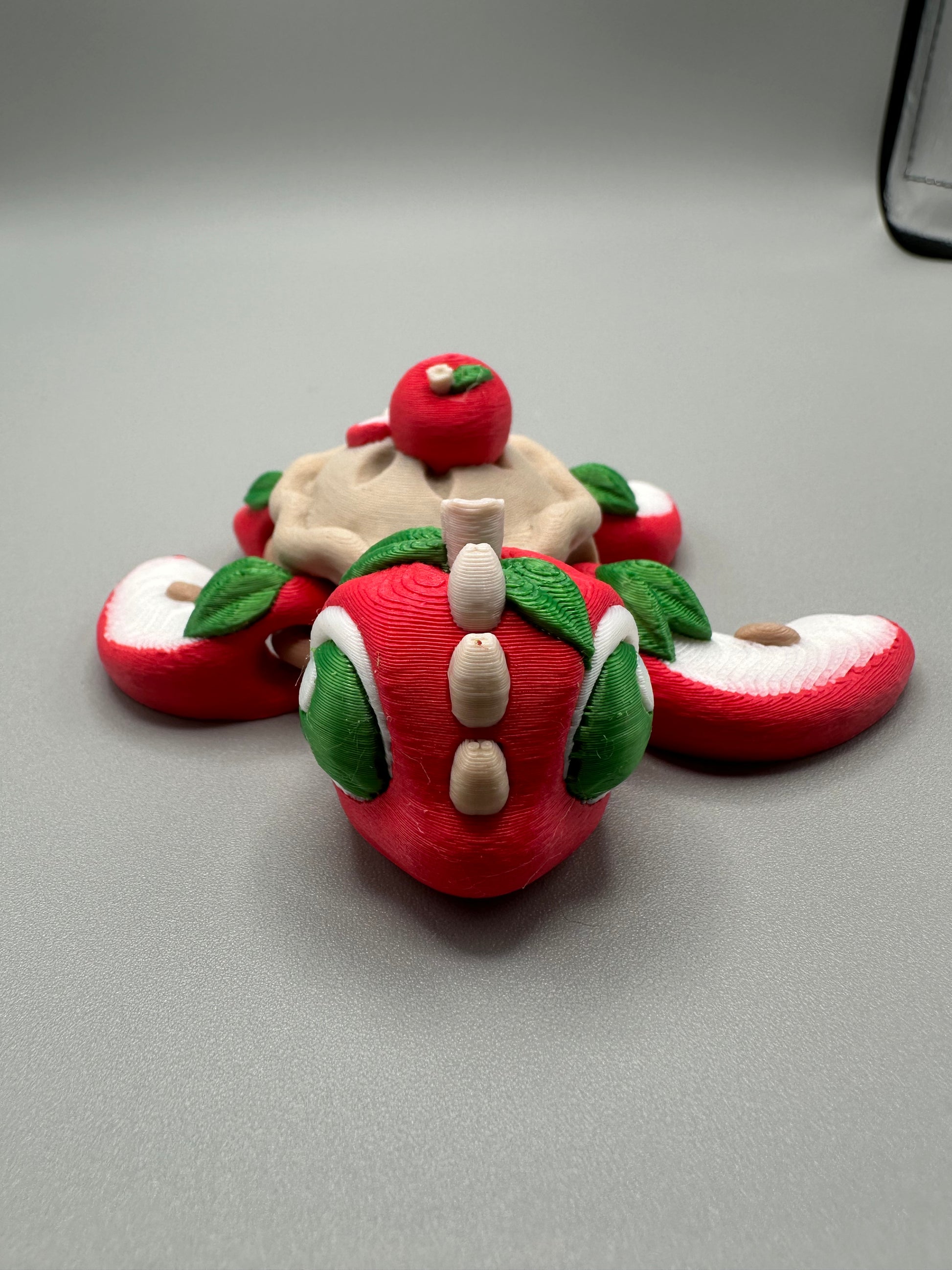 3D printed Apple Pie Turtle figurine with apple-slice shell and leaf accents, by Spokane 3D Printing
