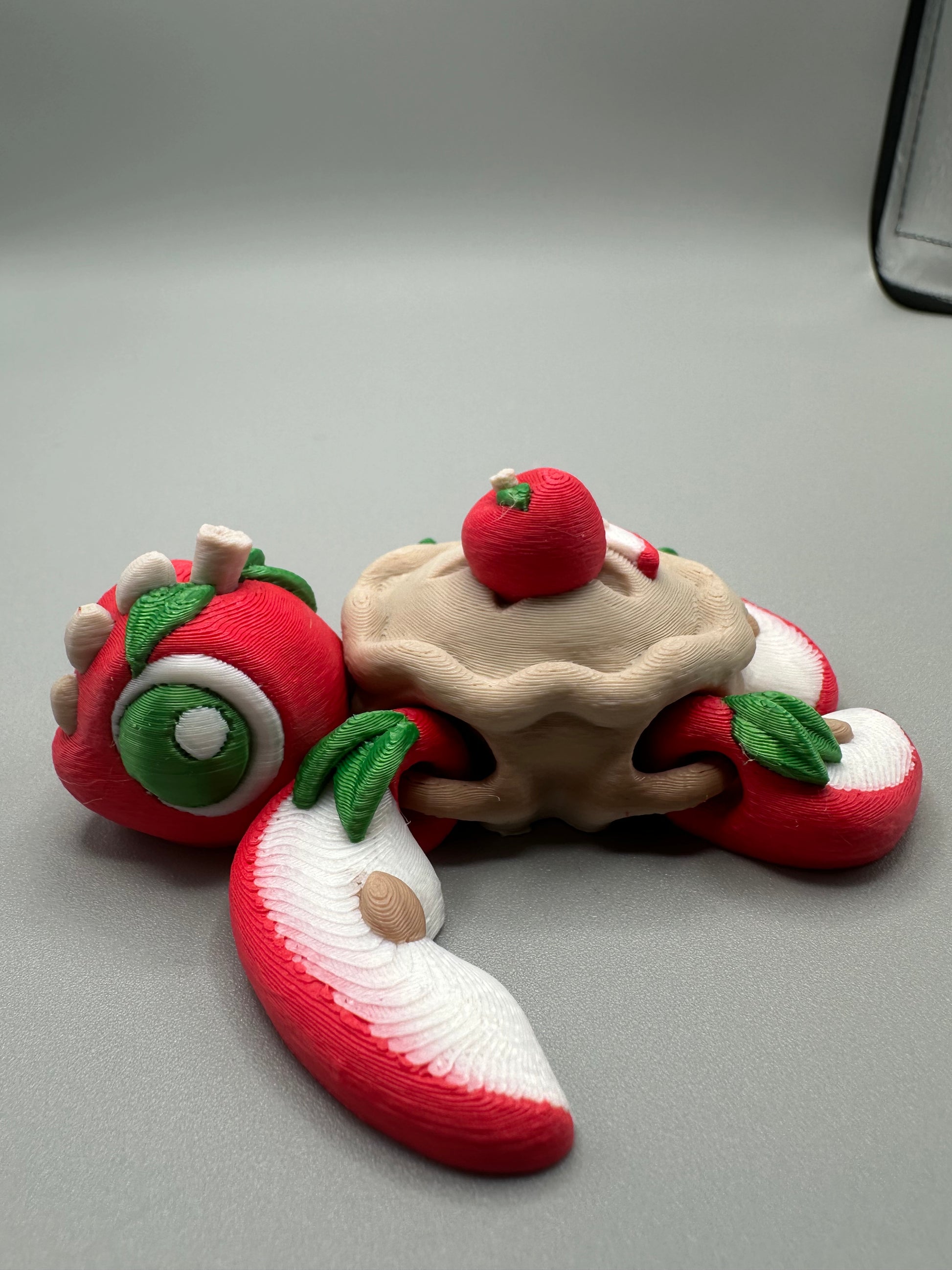 Side view of cute turtle figurine with pie crust pattern and leafy details
